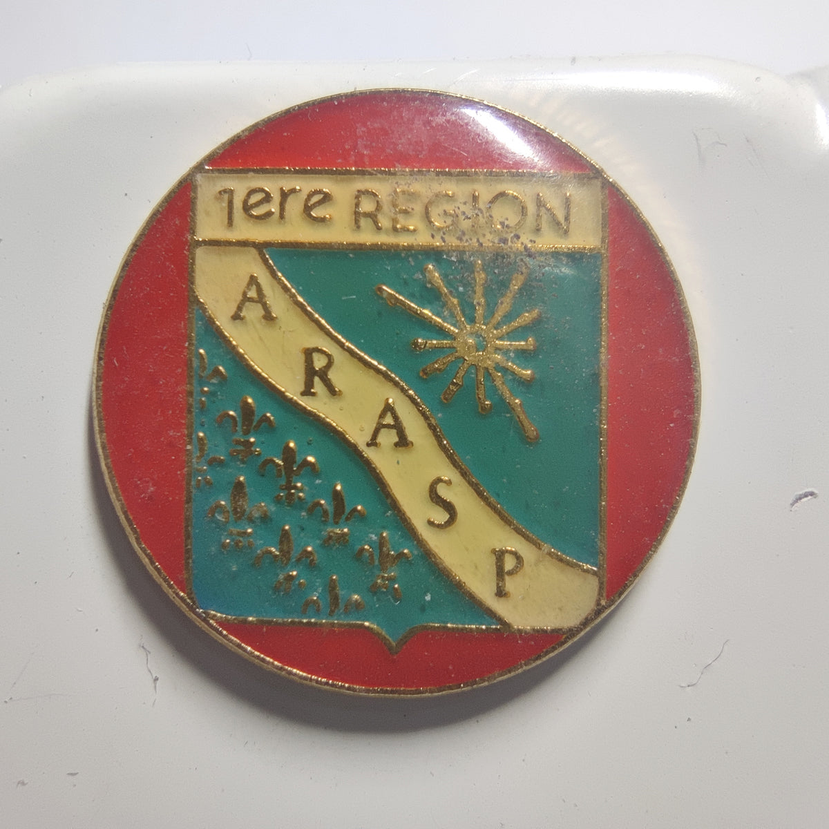 Pin’s ARASP, 1re région, modèle rond, vers 1990